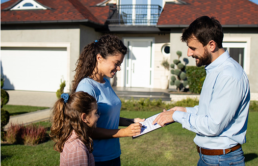 Real estate agent and client shaking hands
