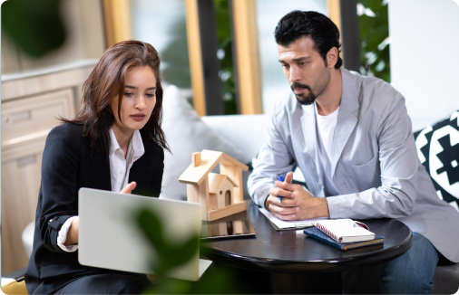 Real estate agent and client shaking hands