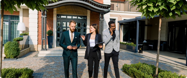 Real estate agent and client shaking hands